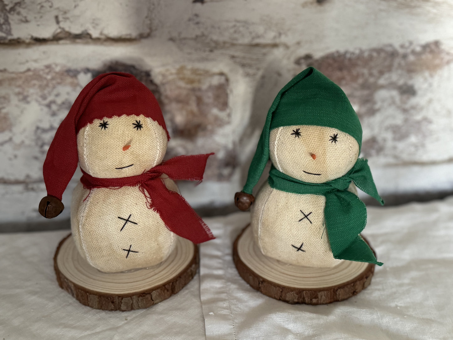 Snowman on wood slice